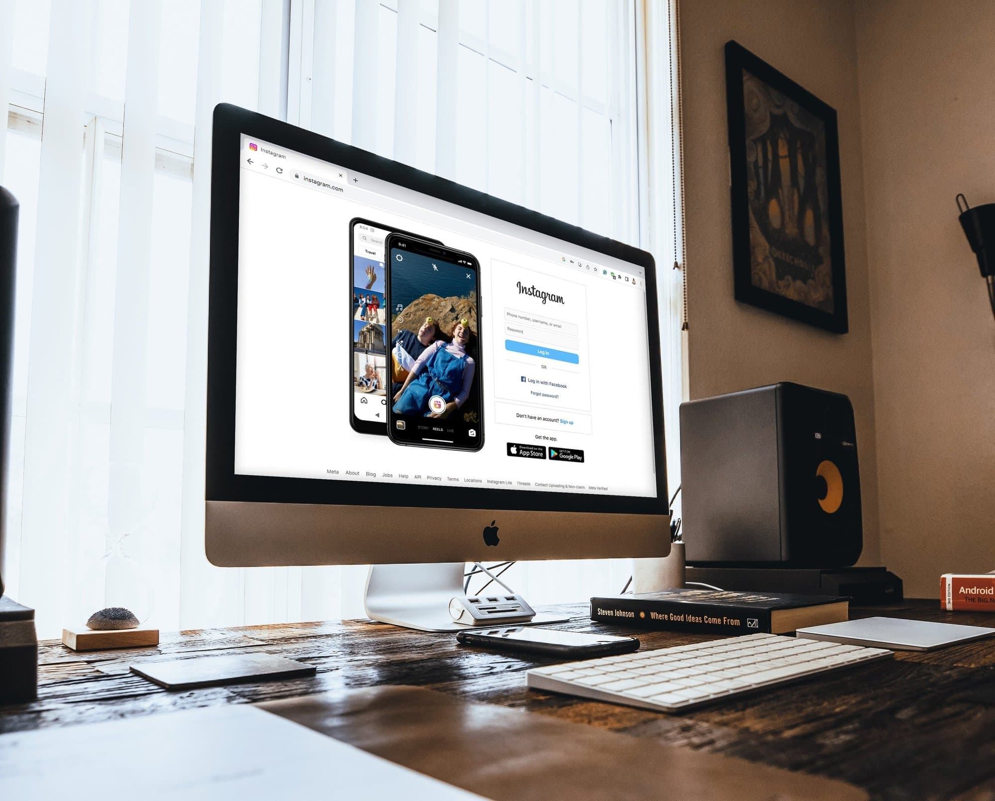 Studio desk with a computer open to Instagram.